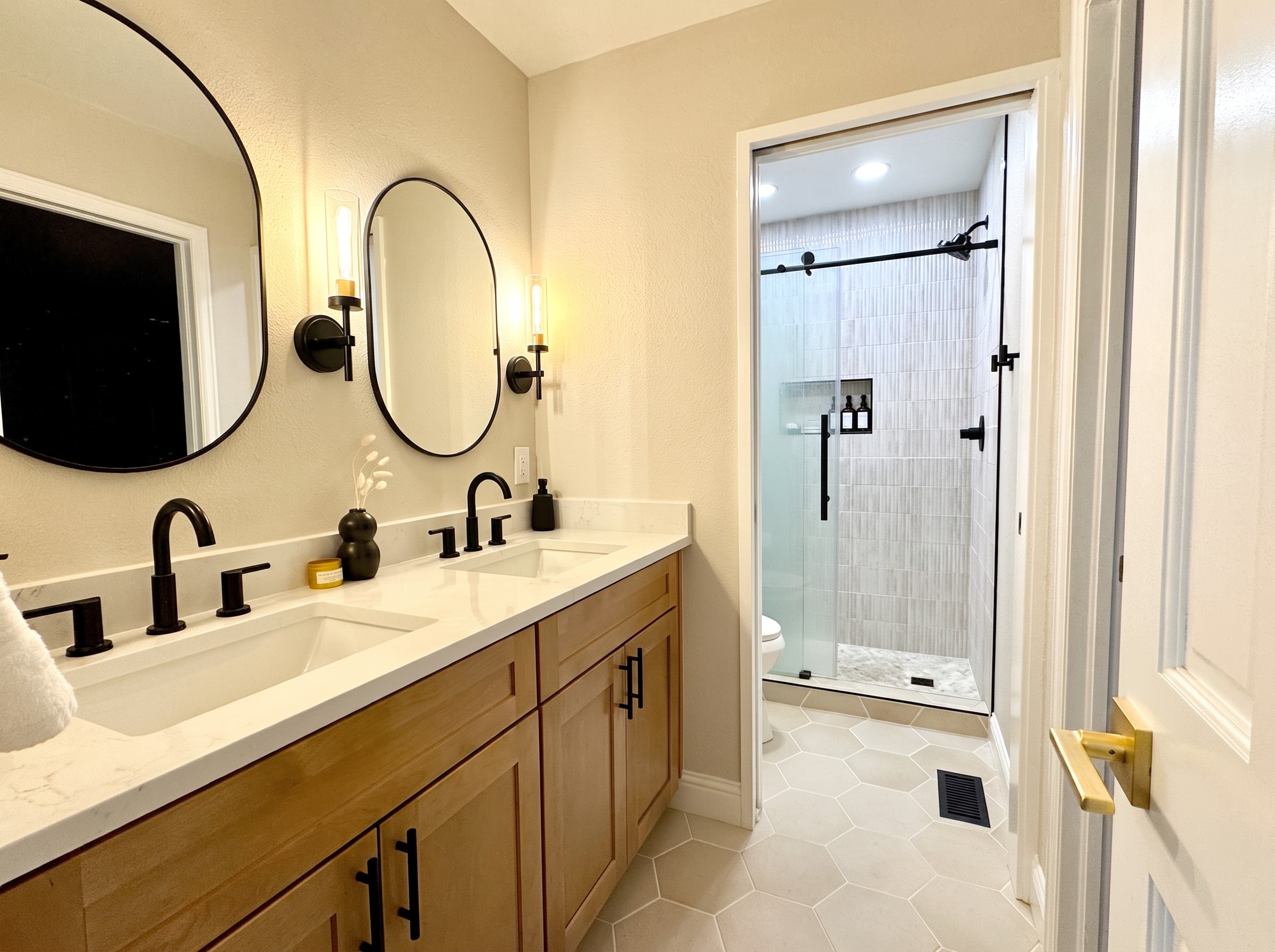 Modern double vanity and walk-in shower after Sinkovec Remodeling remodel